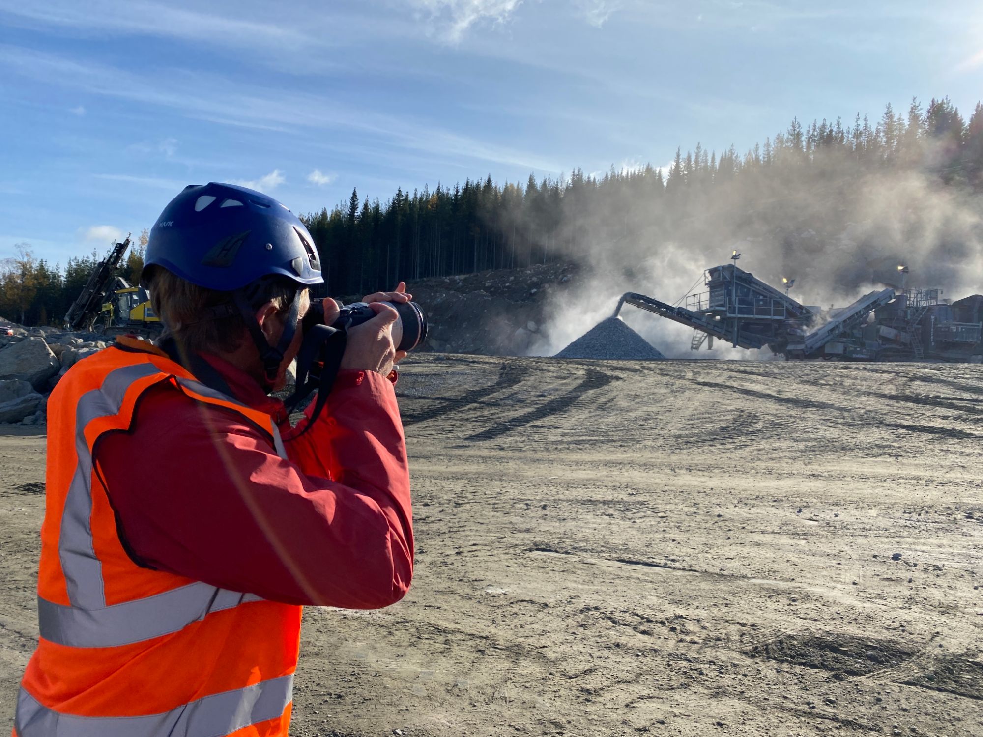 Seb Chandler photographing a quarry crusher on site